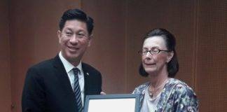 Minister Lee presented with poster in connection with AUCs Community Action Day