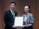 Minister Lee presented with poster in connection with AUCs Community Action Day