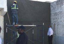 Minister De Weever views House of Detention repairs