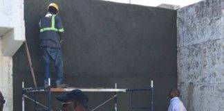 Minister De Weever views House of Detention repairs