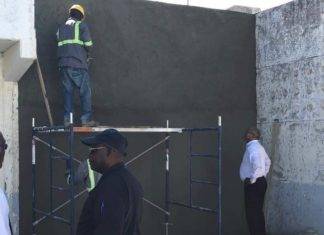 Minister De Weever views House of Detention repairs