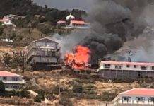 Live video coverage of a large building on fire in Hell’s Gate SABA