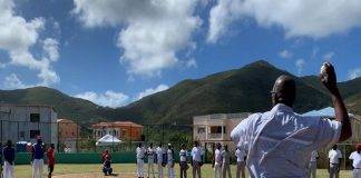 Minister Samuel delivers the game two opening pitch