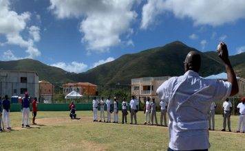 Minister Samuel delivers the game two opening pitch