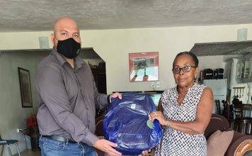 Chris Wever donates school bags with school supplies to Benjamin foster home