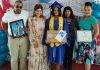 Island Gems presents laptops to two valedictorians