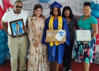 Island Gems presents laptops to two valedictorians