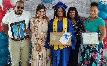 Island Gems presents laptops to two valedictorians