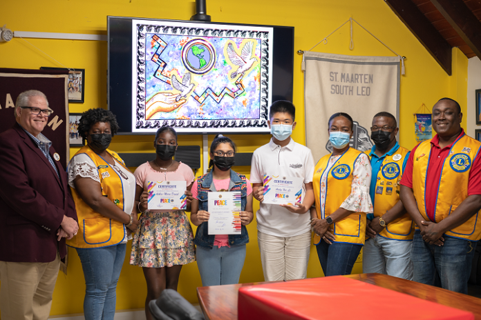 Left to right: District Governor 60B Lion Claudio Buncamper PMJF, Sint Maarten Lions Club President Lion Linette A. Gibs, 3rd prize winner Ashley-Marie Daniel, 1st prize winner Chandri Chandiramanie, 2nd prize winner Andy Xie Li, Youth & Education Committee Chair Lion Rose Hughes-Coram, Zone Chair 2B Lion Alphons Gumbs MJF and Peace Poster Committee Chair Lion Alvin Prescod