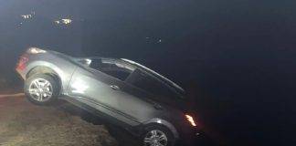 Car drives over the cliff