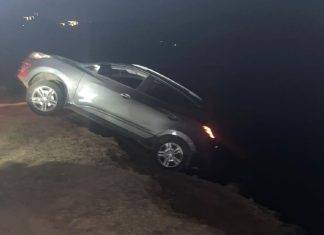Car drives over the cliff