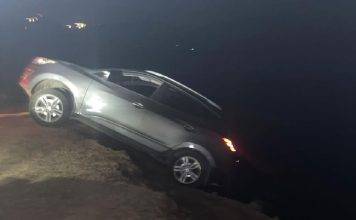 Car drives over the cliff