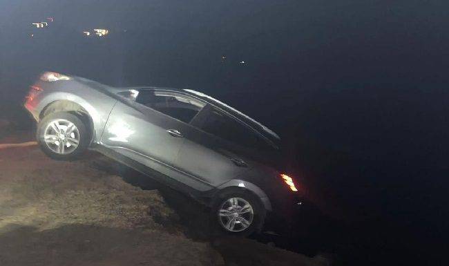 Car drives over the cliff
