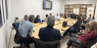 Minister Ottley meets with the exit strategy team to discuss the steps towards normalcy.