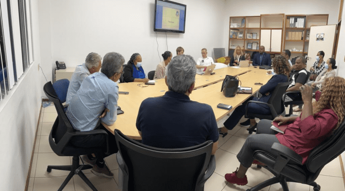 Minister Ottley meets with the exit strategy team to discuss the steps towards normalcy.