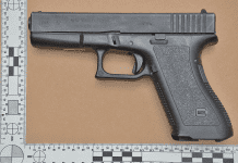 Firearm and false documents confiscated Cole Bay raid