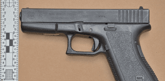 Firearm and false documents confiscated Cole Bay raid