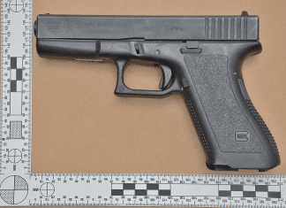 Firearm and false documents confiscated Cole Bay raid