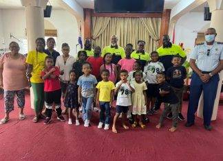 Officers talk about good conduct with summer camp kids