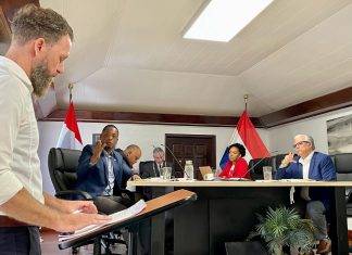 Island Council discusses service, plans of Satel NV Satel NV representative Tim van Oosteren (left) answering the many questions that were posed by the Island Council.