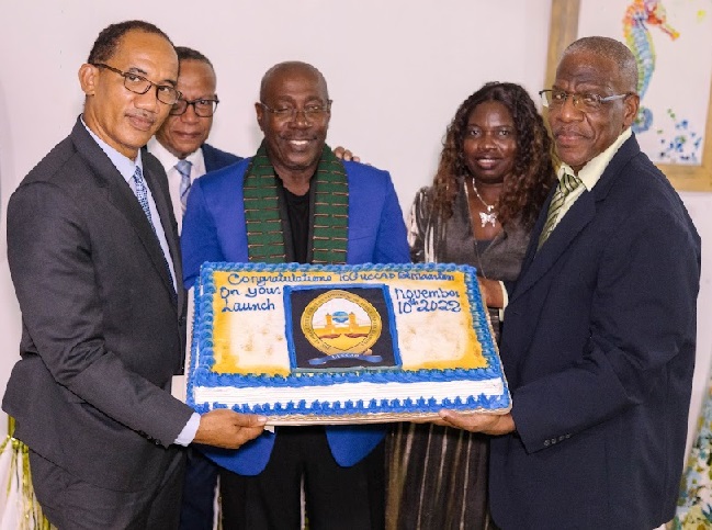 GUCCAD SXM Launch Board Holding Cake