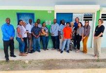 Unveiling plaque in memory to Grace Maccow at Milton Peters College