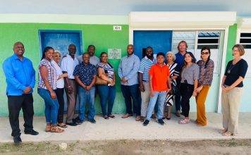 Unveiling plaque in memory to Grace Maccow at Milton Peters College