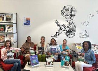 Island Gems donate French history and geography textbooks to Lycée polyvalent