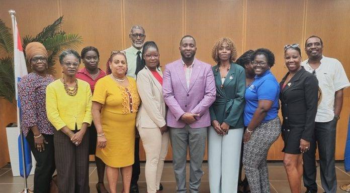 Acting Minister of ECYS Lyndon Lewis meets with WITU