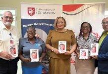 Minister Marinka Gumbs Presents USM with book on Claude to mark his 98th birthday