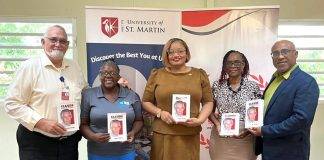 Minister Marinka Gumbs Presents USM with book on Claude to mark his 98th birthday