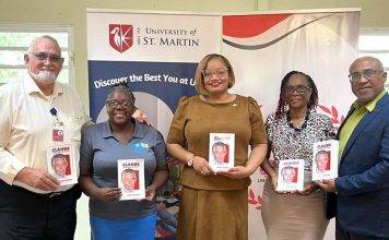 Minister Marinka Gumbs Presents USM with book on Claude to mark his 98th birthday