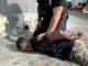 Attempted assault on police officer and destruction of police vehicle by suspect who was later apprehended by French Authorities