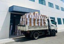 Minister of Finance Marinka Gumbs Joins in Clean Up of Tax Office 560 boxes removed to create better working environment