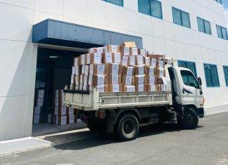 Minister of Finance Marinka Gumbs Joins in Clean Up of Tax Office 560 boxes removed to create better working environment