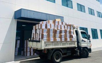 Minister of Finance Marinka Gumbs Joins in Clean Up of Tax Office 560 boxes removed to create better working environment