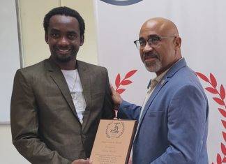 USM Honours Henry Michel for 35th Anniversary Logo Design