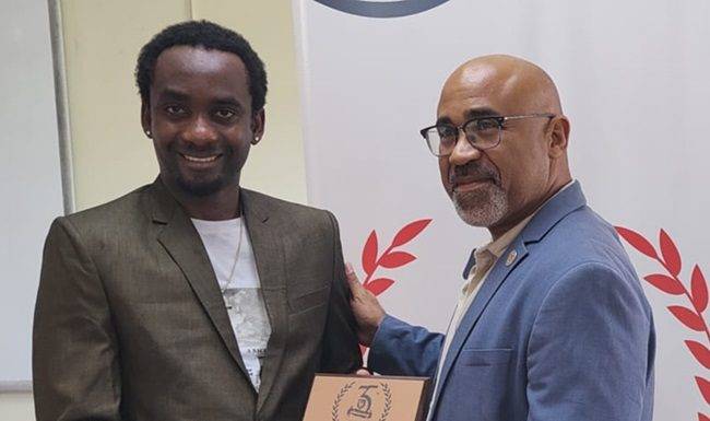 USM Honours Henry Michel for 35th Anniversary Logo Design