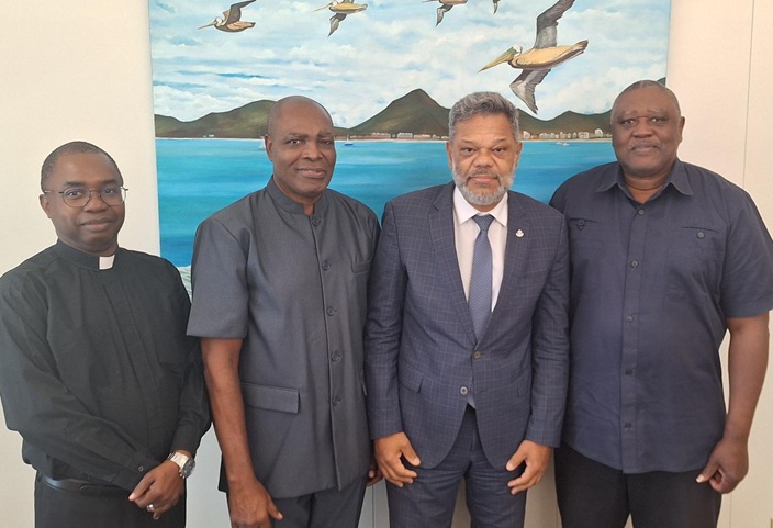 Left to right: Archdeacon Terrence Rawlins of the St. Maarten/St. Martin Christian Council, Pastor Virgil Sams of the Seventh Day Adventist Church and Dr. Orlando Wilson of the St. Maarten United Ministerial Foundation (SMUMF) with Honorable Prime Minister Dr. Luc Mercelina