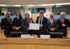 SER Curaçao signs international cooperation agreement in Brussels