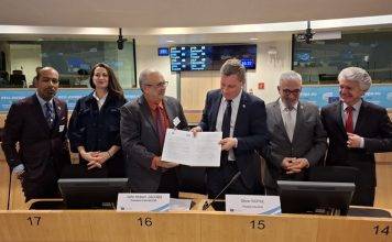 SER Curaçao signs international cooperation agreement in Brussels