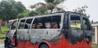 Passenger van caught on fire, no injuries reported