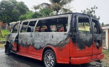 Passenger van caught on fire, no injuries reported
