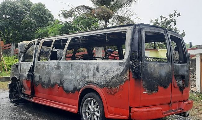 Passenger van caught on fire, no injuries reported