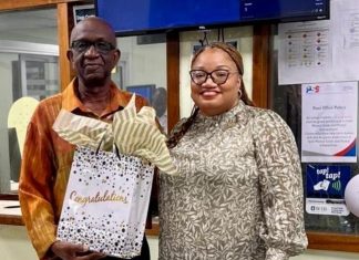 Finance Minister Gumbs pays tribute to Cedric Kirindongo on his 35 Years at Postal Services St. Maarten N.V.