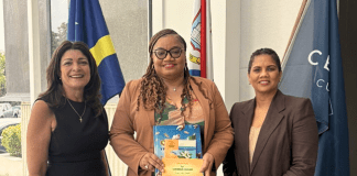 Minister of Finance, Marinka J. Gumbs, Presented with Historical NAf Book and Caribbean Guilder Collector’s Set