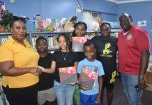 L.O.V.E 2 L.E.A.R.N. Foundation Donates Inspirational Book Art at the Sea to Sint Maarten Library