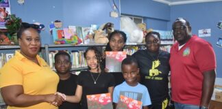 L.O.V.E 2 L.E.A.R.N. Foundation Donates Inspirational Book Art at the Sea to Sint Maarten Library