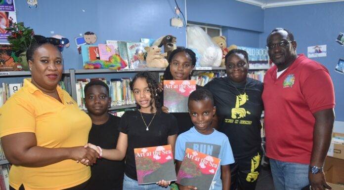 L.O.V.E 2 L.E.A.R.N. Foundation Donates Inspirational Book Art at the Sea to Sint Maarten Library