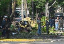 Attack on police helicopter and explosion near air base leave at least 14 dead in Colombia, officials say